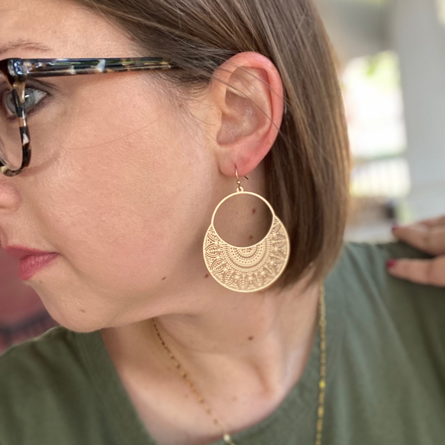 Lady wearing Waterproof filigree gold earrings